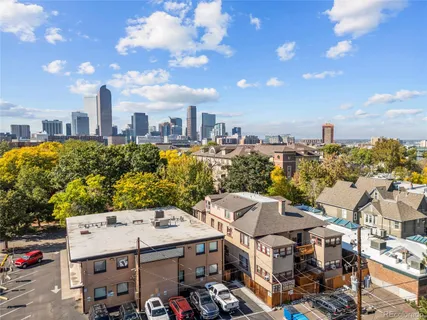 an aerial view of multiple houses with yard