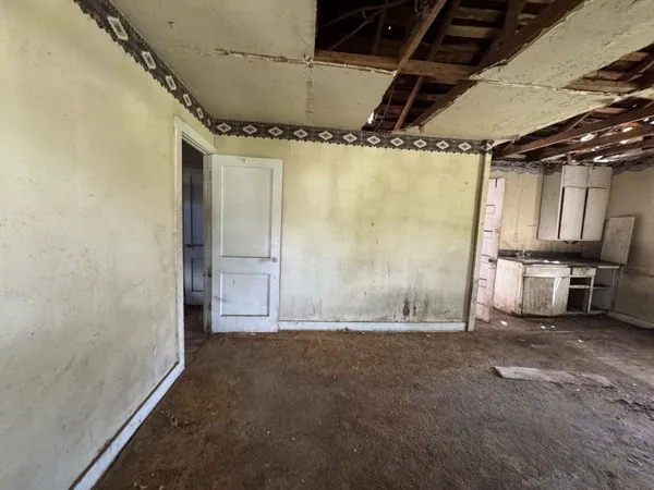 a view of a room with wooden walls
