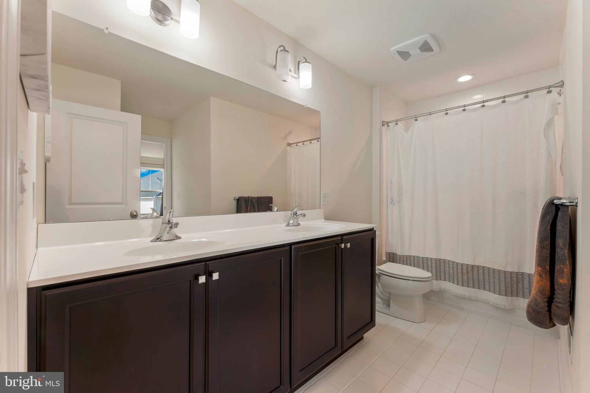 2 Parry Way Warminster, PA 18974 - Photo 27 of 41 a bathroom with a double vanity sink toilet and a mirror