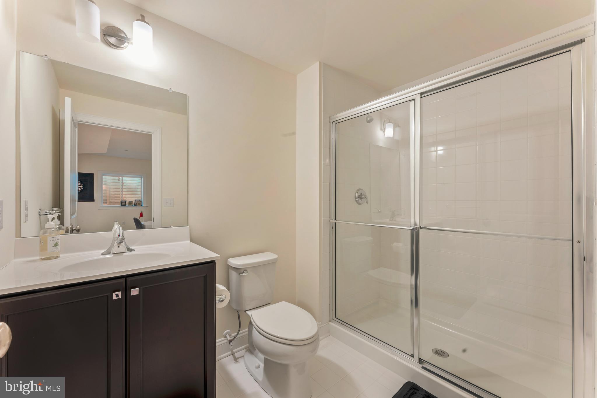 2 Parry Way Warminster, PA 18974 - Photo 37 of 41 a bathroom with a shower sink vanity mirror and toilet