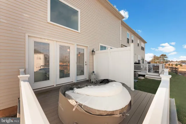 a view of a house with a chairs in patio