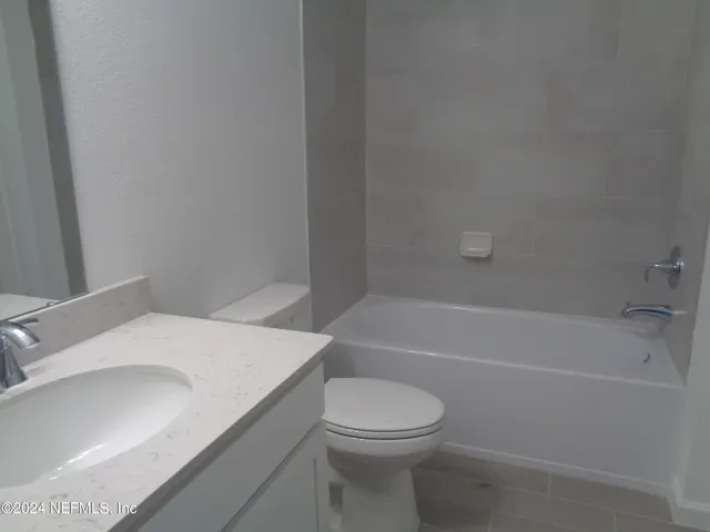 a view of a hallway with white walls