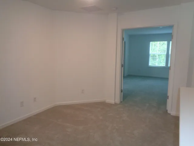 a view of a back yard of the house