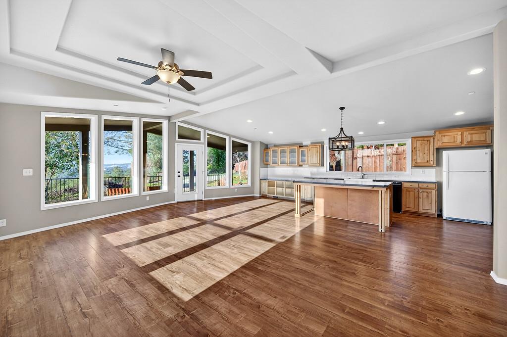 235 Grimont Road Oroville, CA 95966 - Photo 14 of 68 a living room with stainless steel appliances kitchen island granite countertop a stove and a large window