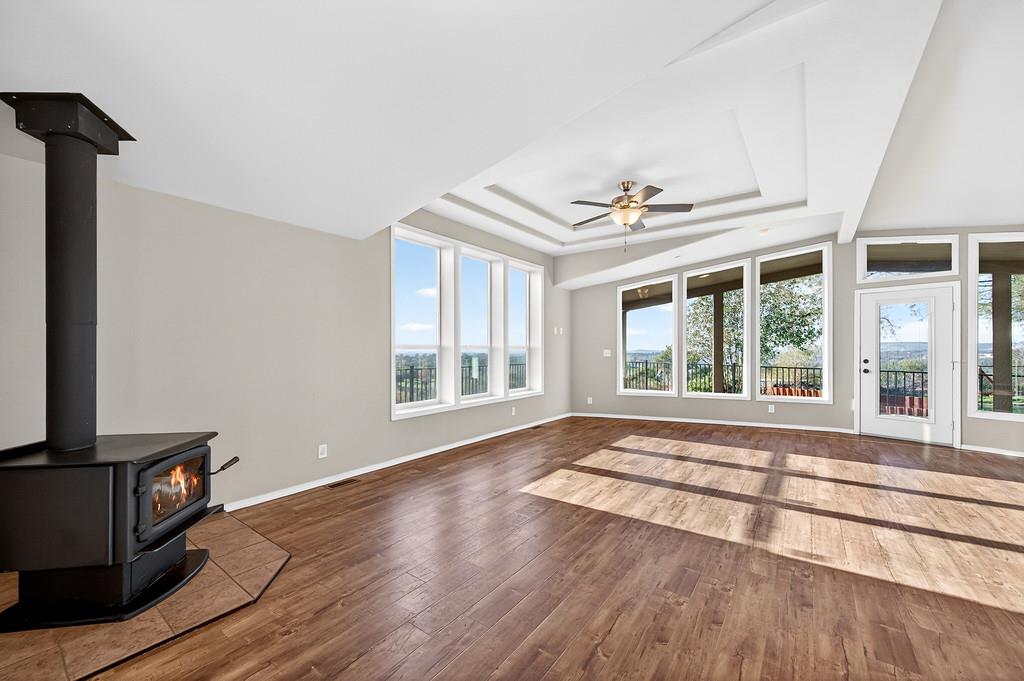 235 Grimont Road Oroville, CA 95966 - Photo 15 of 68 a view of an empty room with a window and wooden floor