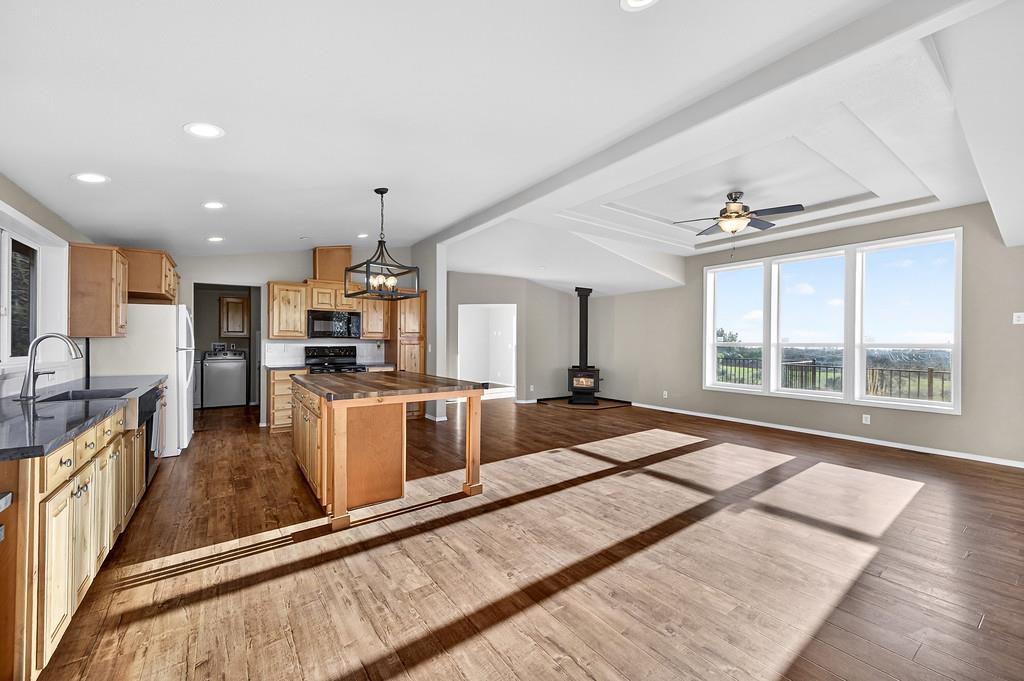 235 Grimont Road Oroville, CA 95966 - Photo 24 of 68 a large kitchen with kitchen island a large counter top space appliances and a center island