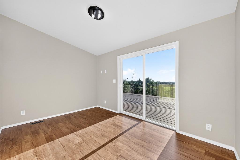 235 Grimont Road Oroville, CA 95966 - Photo 25 of 68 an empty room with wooden floor and windows
