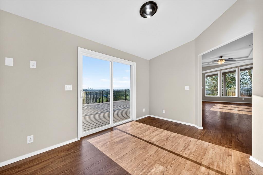 235 Grimont Road Oroville, CA 95966 - Photo 28 of 68 an empty room with wooden floor and windows