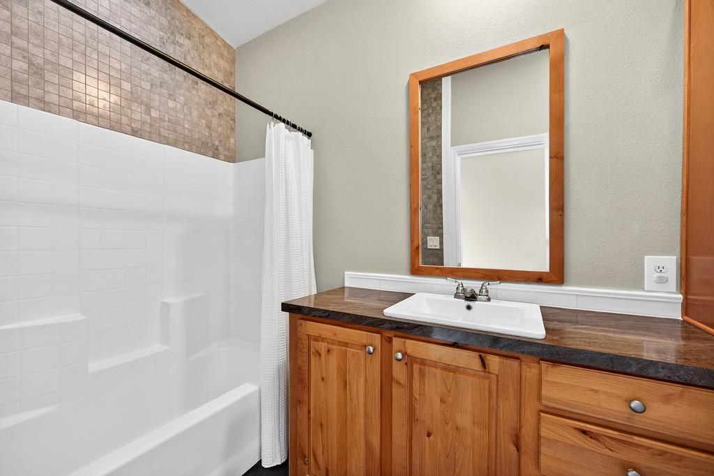 235 Grimont Road Oroville, CA 95966 - Photo 29 of 68 a bathroom with a sink and a bathtub