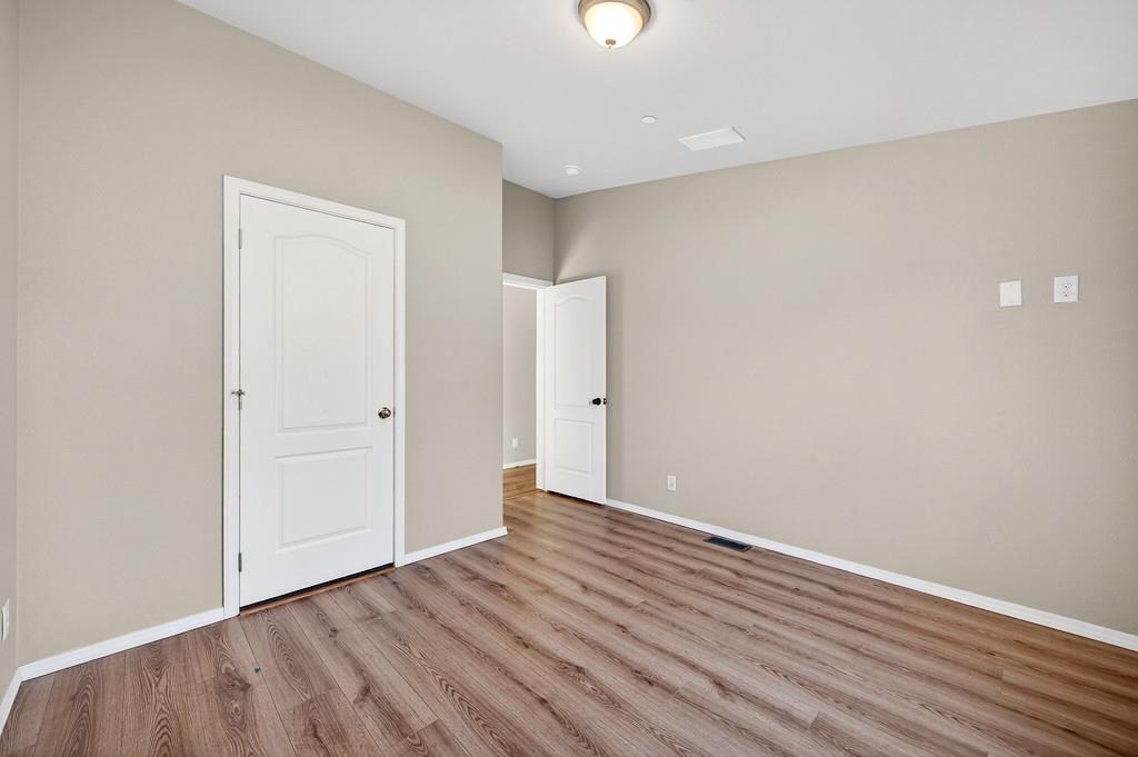 235 Grimont Road Oroville, CA 95966 - Photo 33 of 68 a view of an empty room with wooden floor