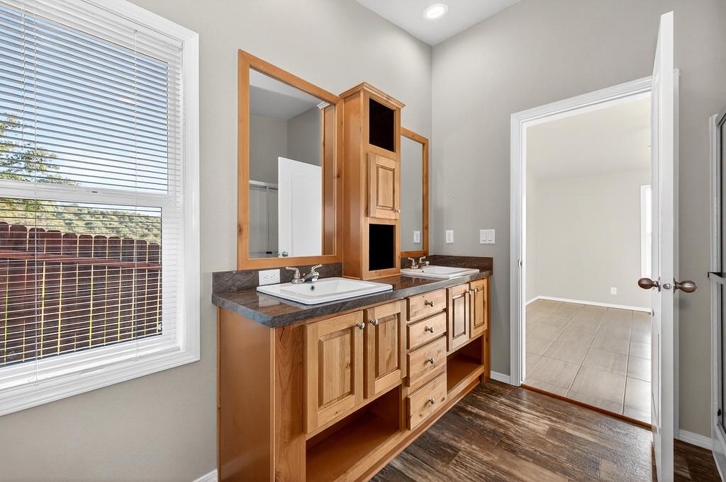 235 Grimont Road Oroville, CA 95966 - Photo 42 of 68 a spacious bathroom with a double vanity sink and mirror