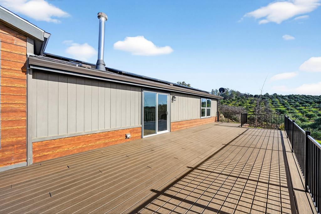 235 Grimont Road Oroville, CA 95966 - Photo 48 of 68 a view of a roof deck with wooden floor and fence