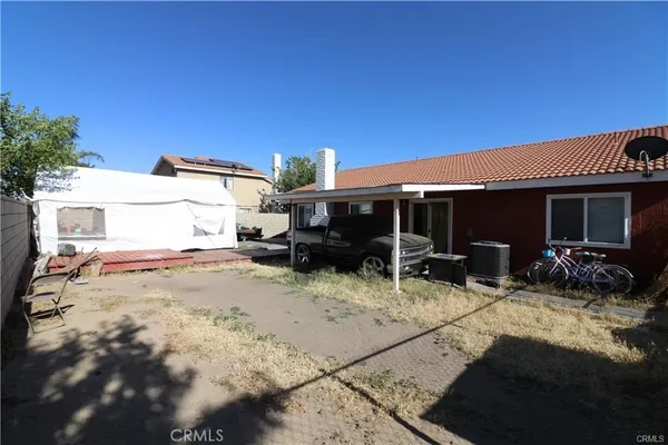 a view of house with a patio