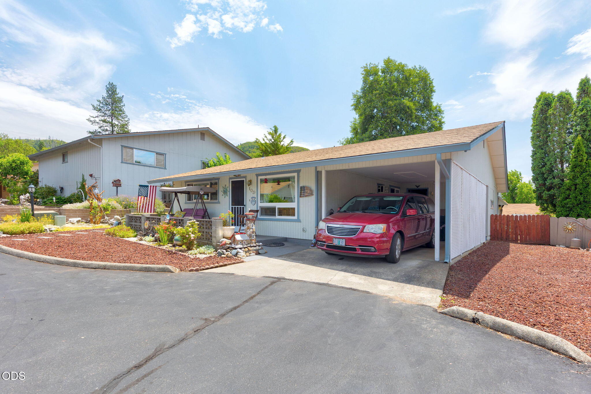103 Brookside Court Rogue River, OR 97537 - Photo 26 of 27 a front view of a house with a garden and porch