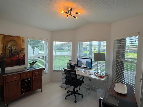a work room with furniture and windows