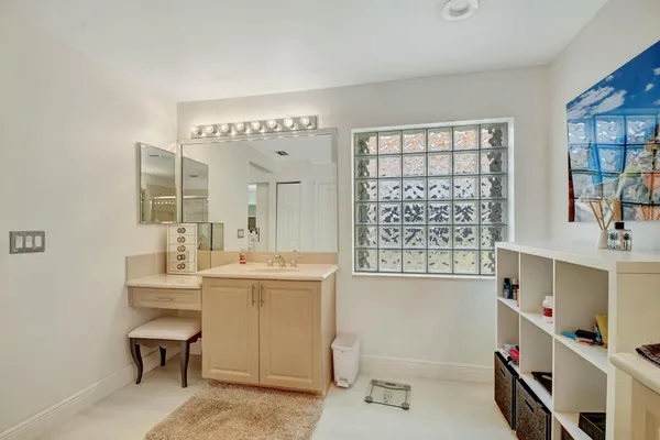 a bedroom with furniture and a flat screen tv