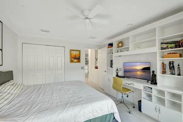 a living room with hardwood floor and a large window