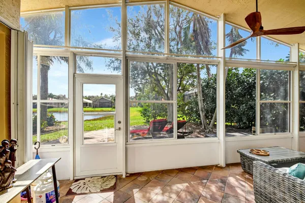a view of living room with furniture and floor to ceiling windows