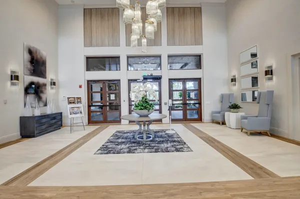 a front view of multiple houses with yard