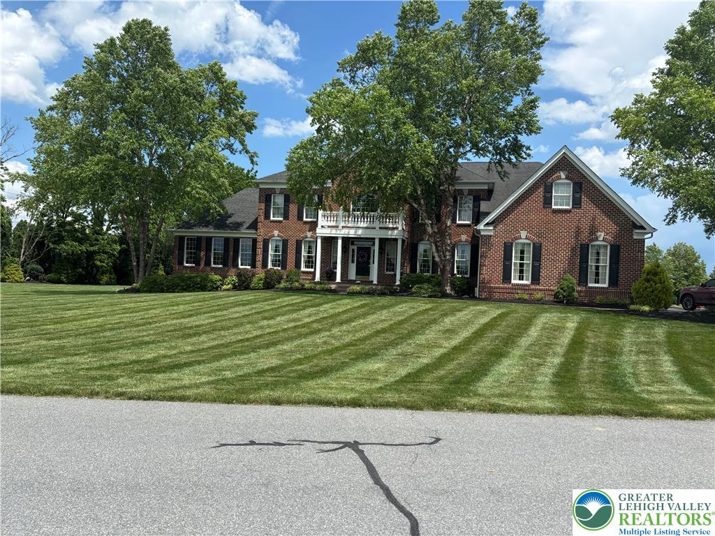 598 Rockbridge Road Nazareth, PA 18064 - Photo 1 of 1 a front view of a house with a garden