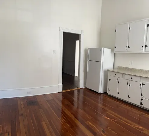 a view of cabinets with wooden floor