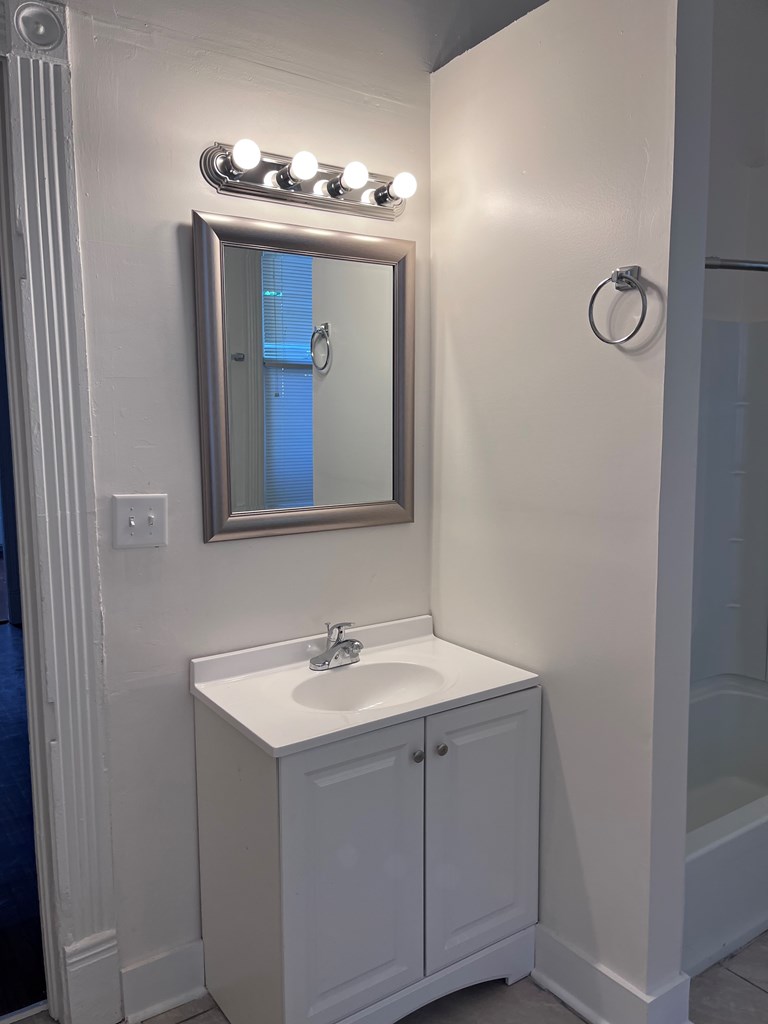 1301 18th Street, Unit A Columbus, GA 31901 - Photo 21 of 21 a bathroom with a sink and a mirror
