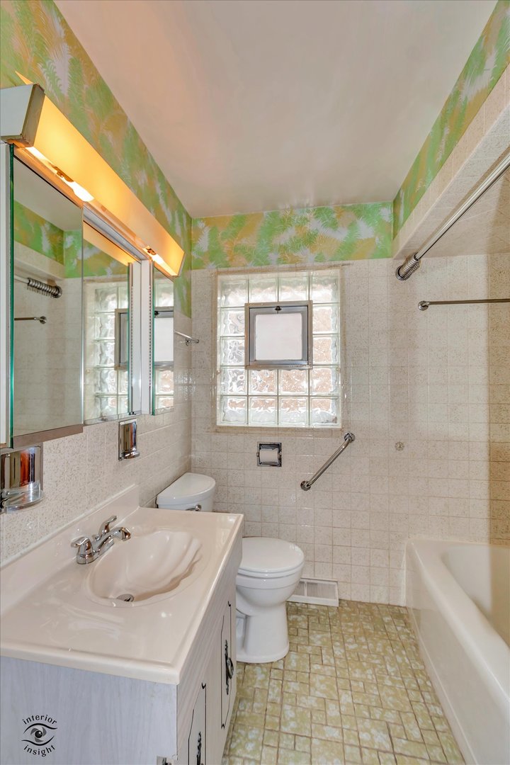6049 South Mobile Avenue Chicago, IL 60638 - Photo 16 of 26 a bathroom with a sink toilet and shower