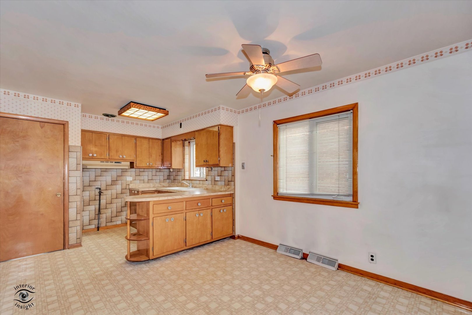 6049 South Mobile Avenue Chicago, IL 60638 - Photo 4 of 26 a view of a kitchen with a sink and a refrigerator