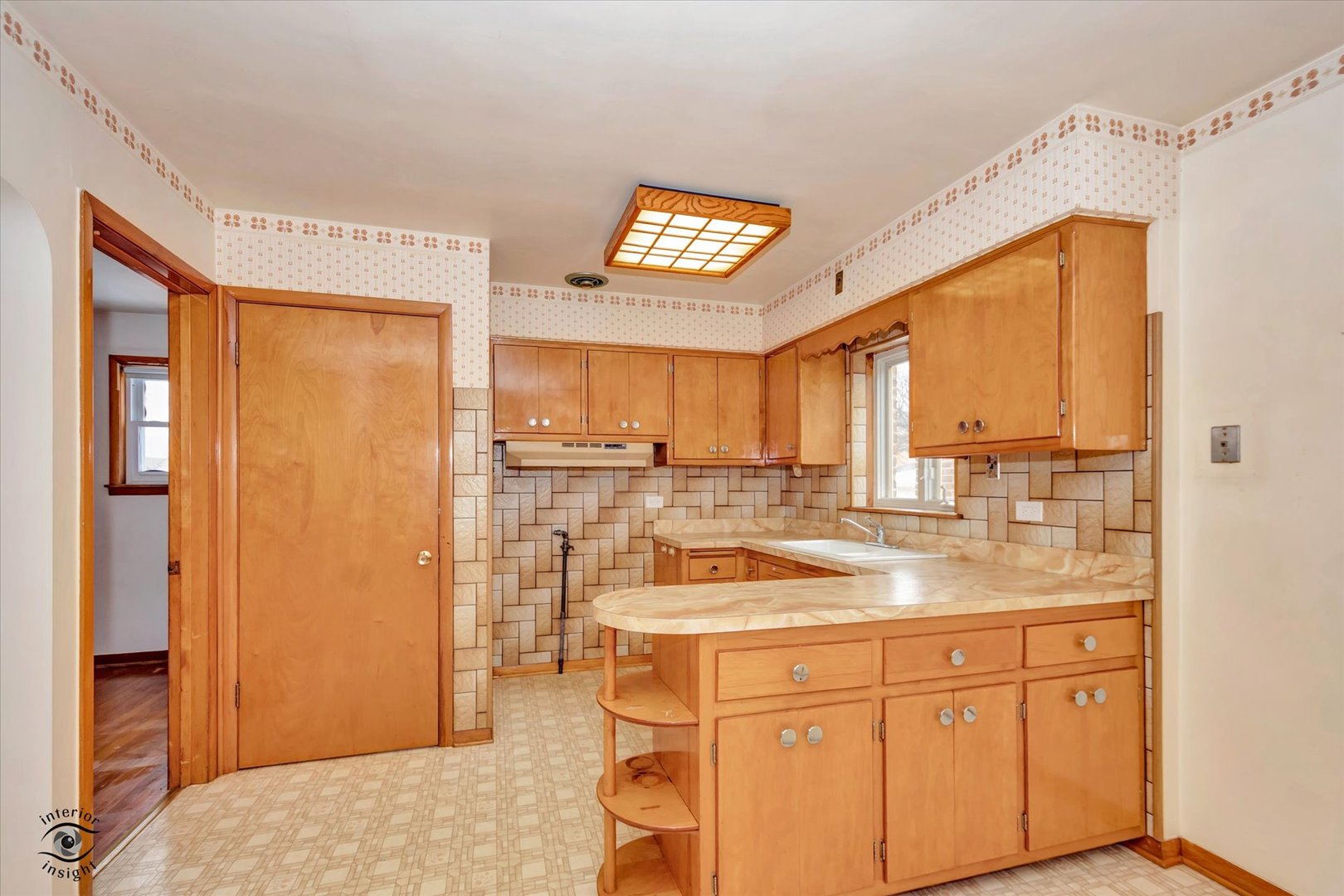 6049 South Mobile Avenue Chicago, IL 60638 - Photo 6 of 26 a kitchen with a refrigerator a sink and cabinets