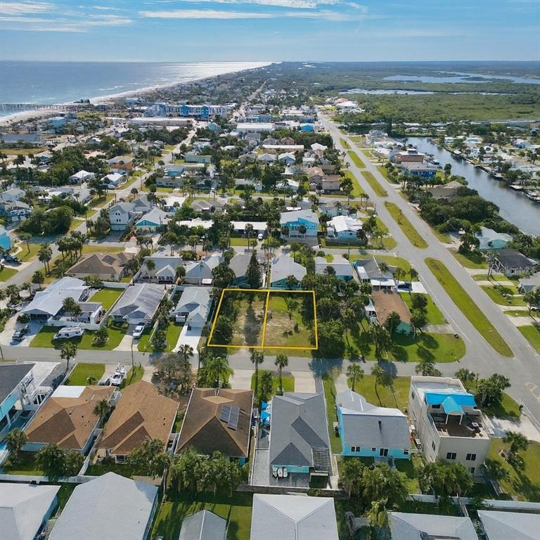 3 North 7th Street Flagler Beach, FL 32136 - Photo 3 of 6 an aerial view of residential building with parking