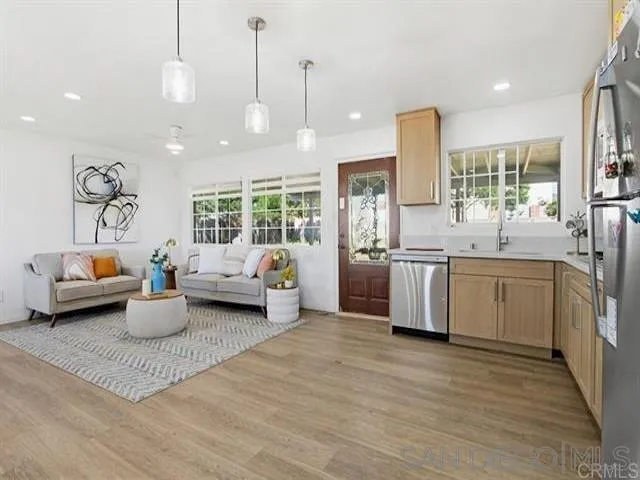 9462 Doheny Road Santee, CA 92071 - Photo 15 of 33 a kitchen with counter top space a sink cabinets and appliances