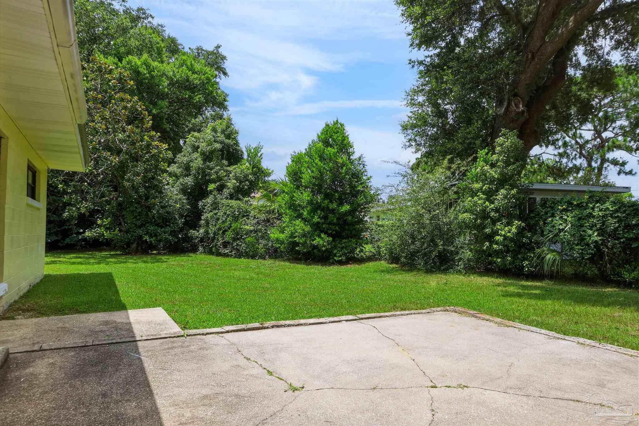 101 Vanderbilt Road Pensacola, FL 32506 - Photo 32 of 33 Backyard, mature trees and patio
