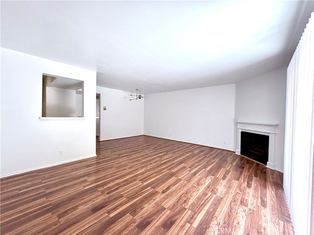 13512 Moorpark Street, Unit 103 Sherman Oaks, CA 91423 - Photo 3 of 10 a view of empty room with wooden floor
