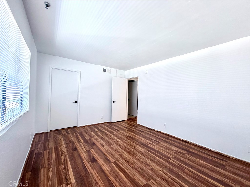 13512 Moorpark Street, Unit 103 Sherman Oaks, CA 91423 - Photo 9 of 10 a view of a room with wooden floor
