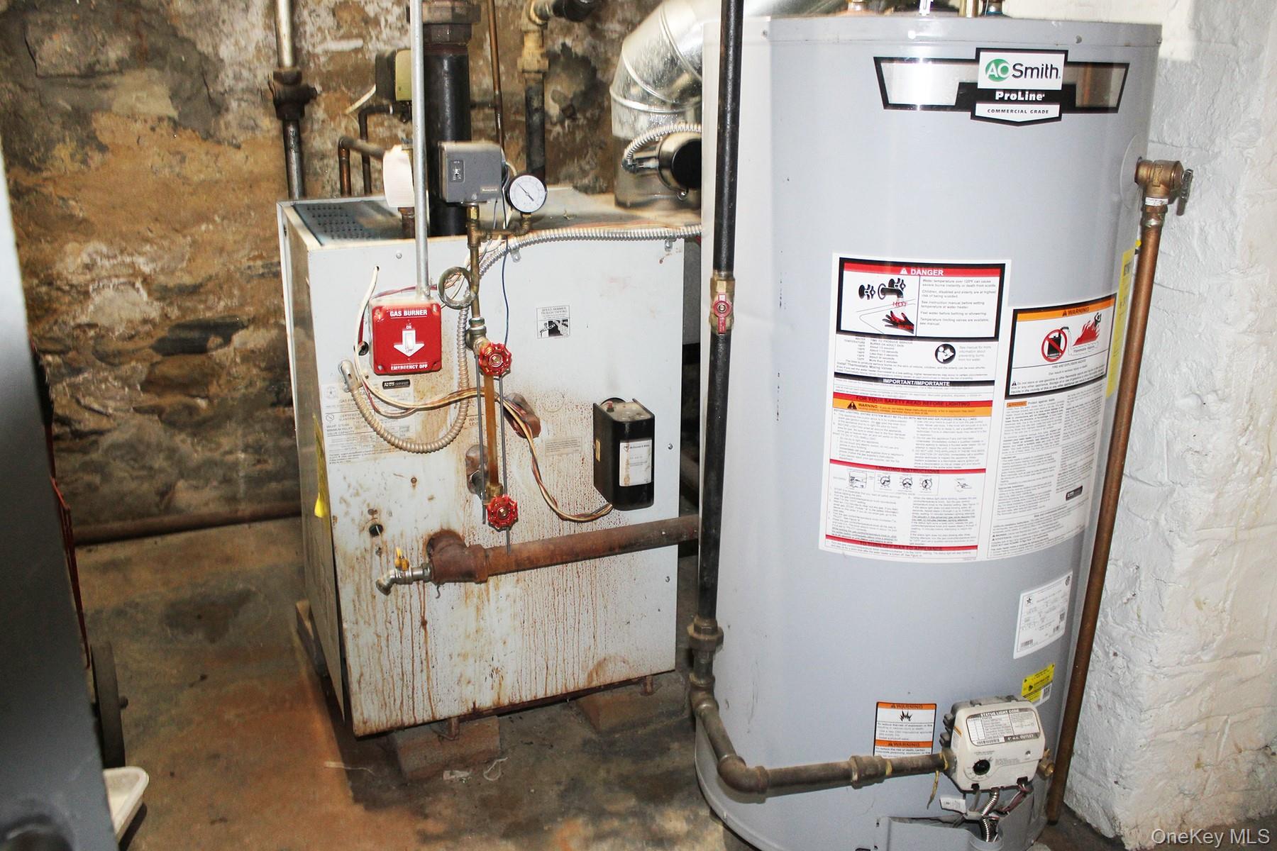 1731 White Plains Road Bronx, NY 10462 - Photo 15 of 16 Utilities with gas water heater and a heating unit