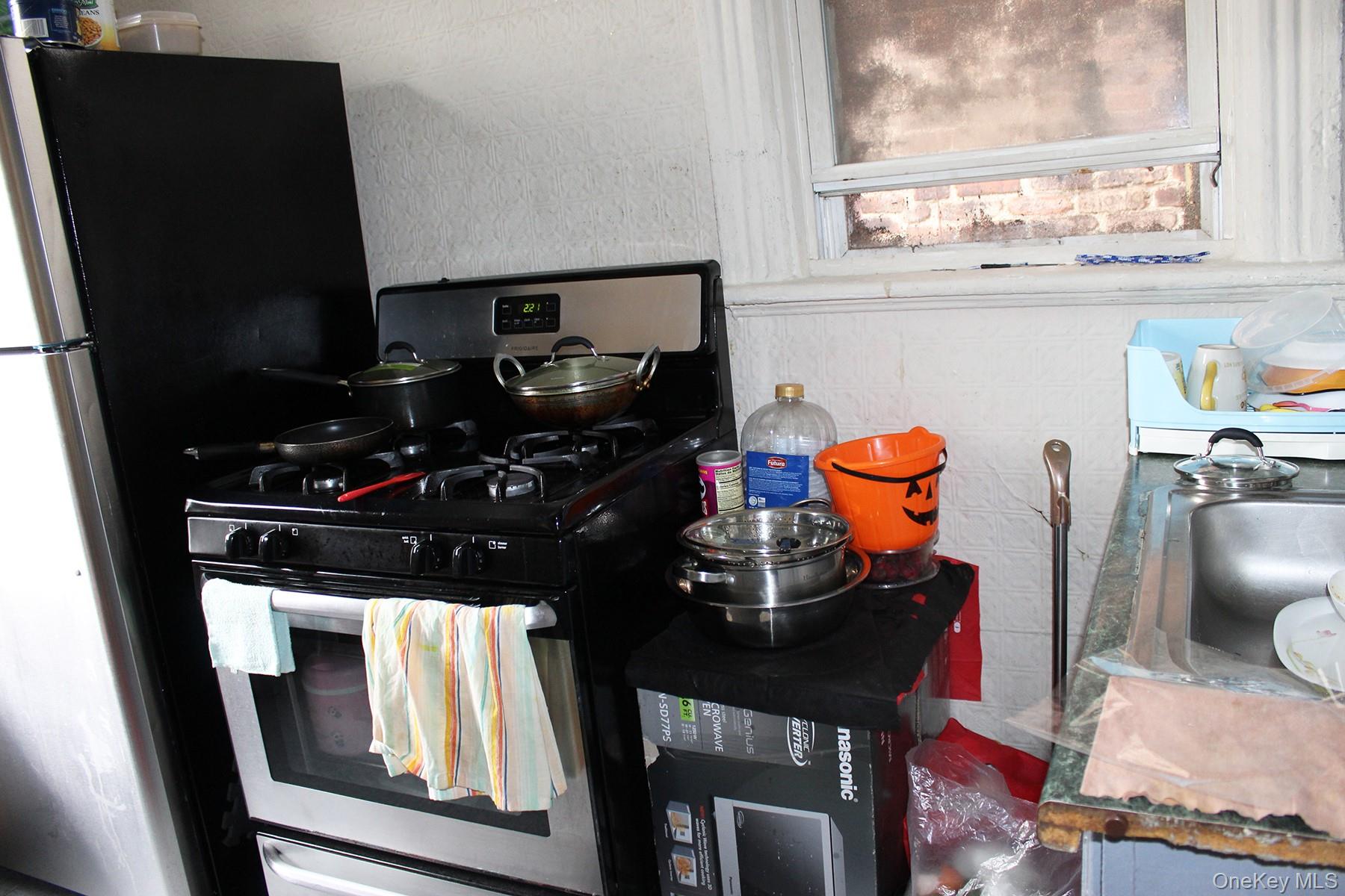 1731 White Plains Road Bronx, NY 10462 - Photo 5 of 16 Kitchen featuring stainless steel range with gas stovetop