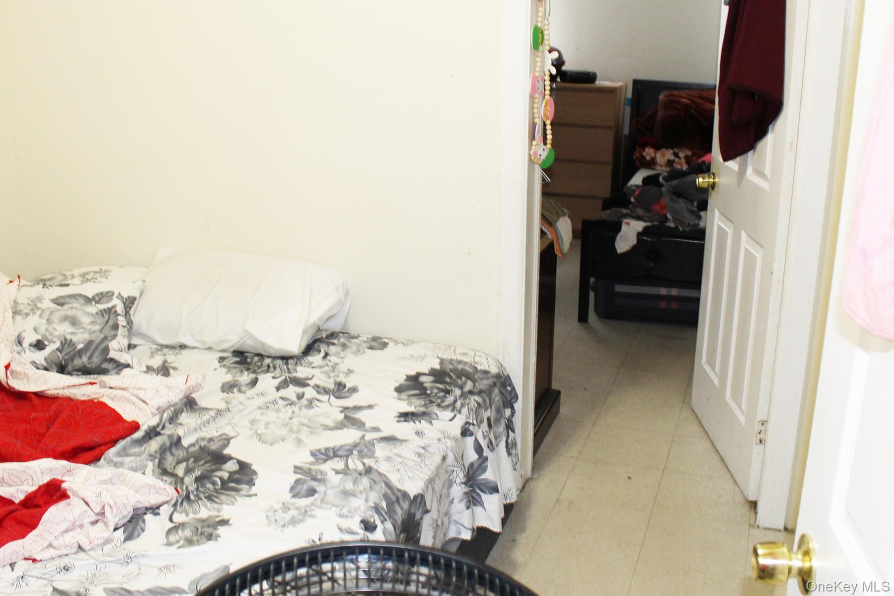 1731 White Plains Road Bronx, NY 10462 - Photo 10 of 16 Bedroom with light tile patterned floors