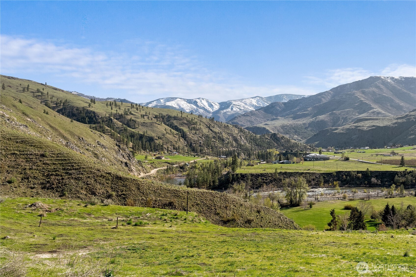 6 Cowboy Road Pateros, WA 98846 - Photo 14 of 38 a view of a lake with mountains in the background