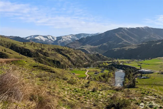 a view of a town with mountains in the background