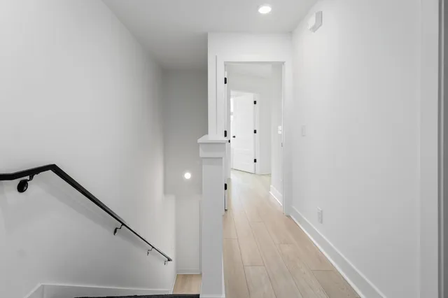 a bathroom with a toilet a sink and a large mirror