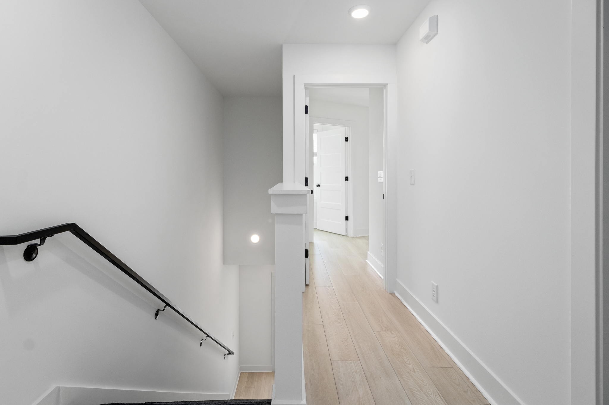 725 Hornbuckle Road, Unit B2 Clarksville, TN 37043 - Photo 18 of 31 a view of a hallway with wooden floor and staircase