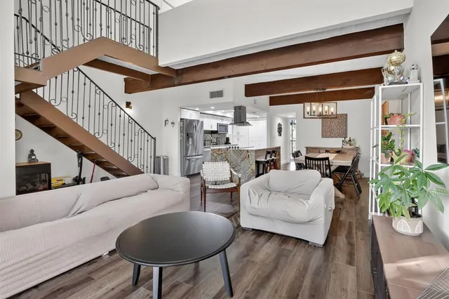 a bedroom with a bed and a table in it