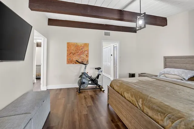 an aerial view of residential houses with outdoor space and river