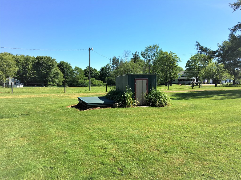 23273 Fry Road Venango, PA 16440 - Photo 15 of 74 a fire hydrant in the middle of a field