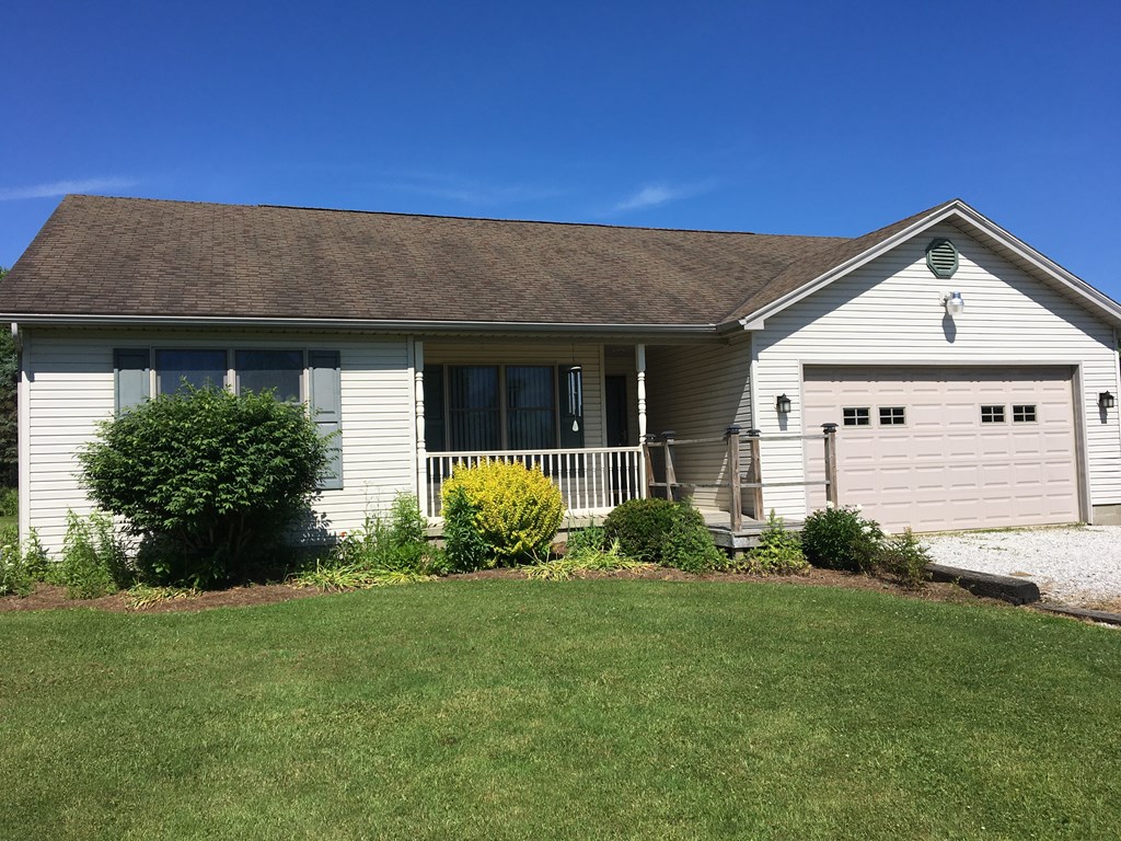 23273 Fry Road Venango, PA 16440 - Photo 28 of 74 a front view of a house with garden