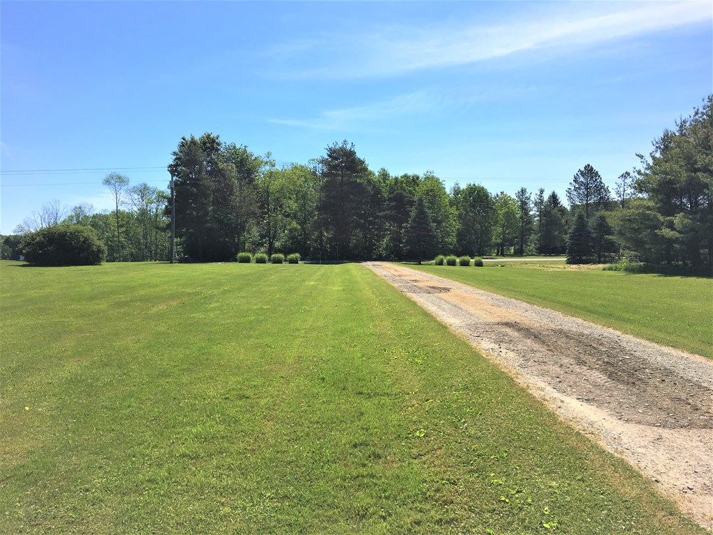 23273 Fry Road Venango, PA 16440 - Photo 3 of 74 a view of a field with trees in the background