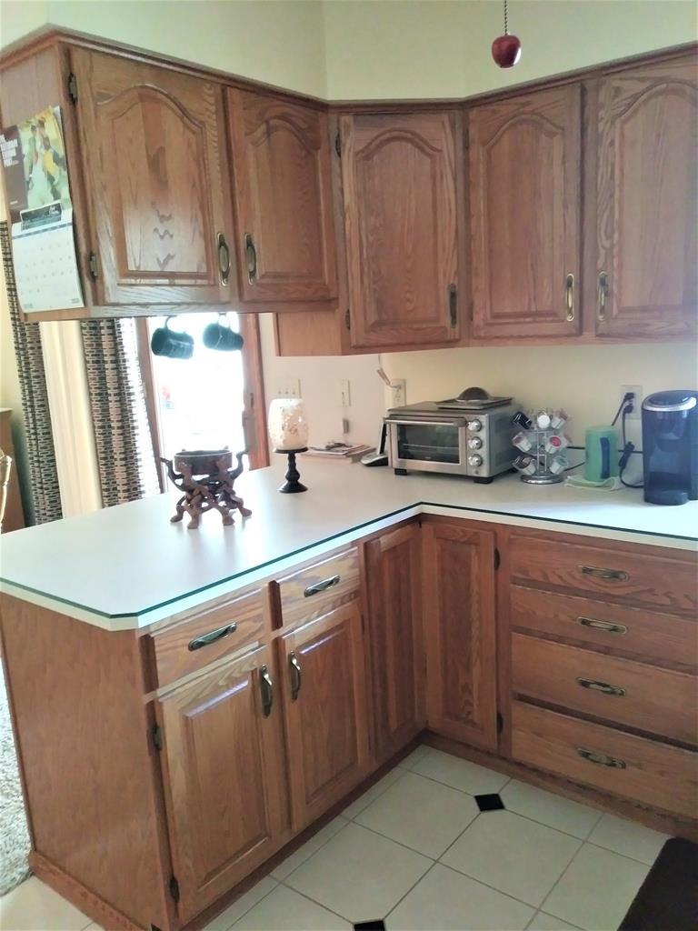 23273 Fry Road Venango, PA 16440 - Photo 31 of 74 a kitchen with stainless steel appliances granite countertop a sink a stove and cabinets