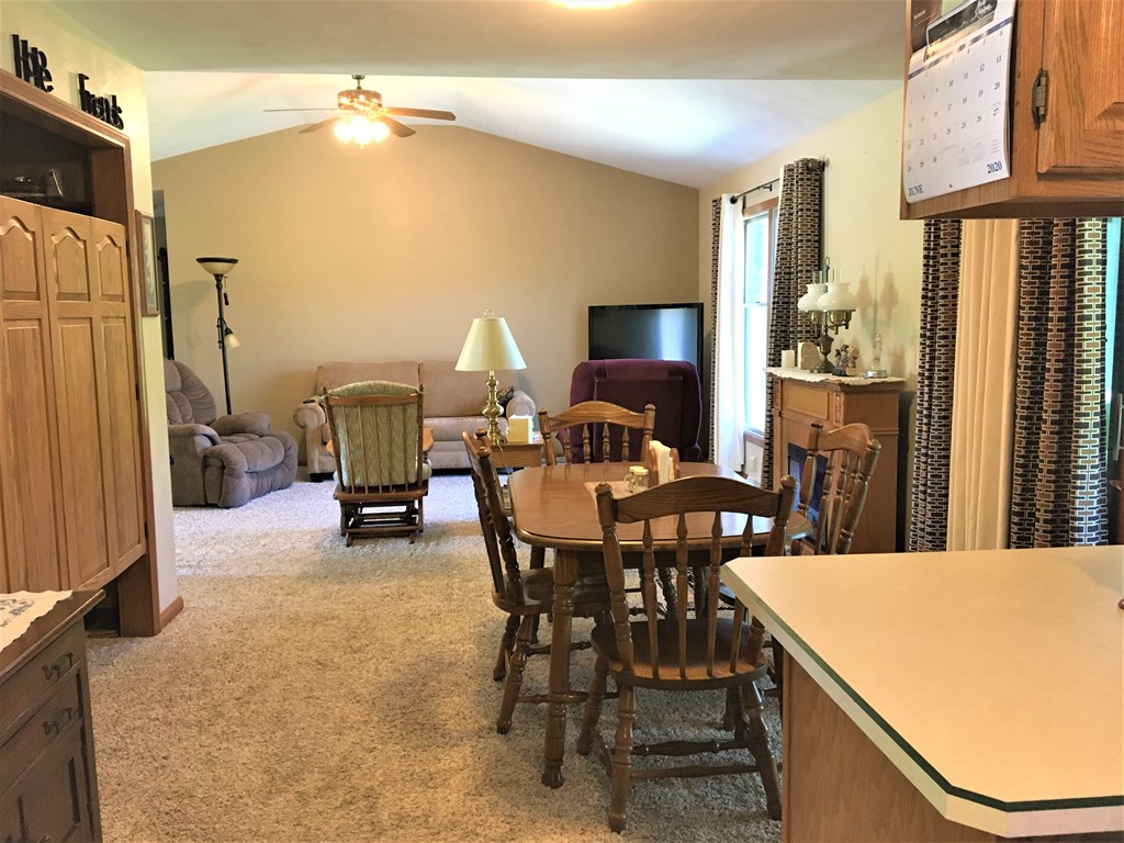 23273 Fry Road Venango, PA 16440 - Photo 36 of 74 a view of a dining room with furniture and a chandelier