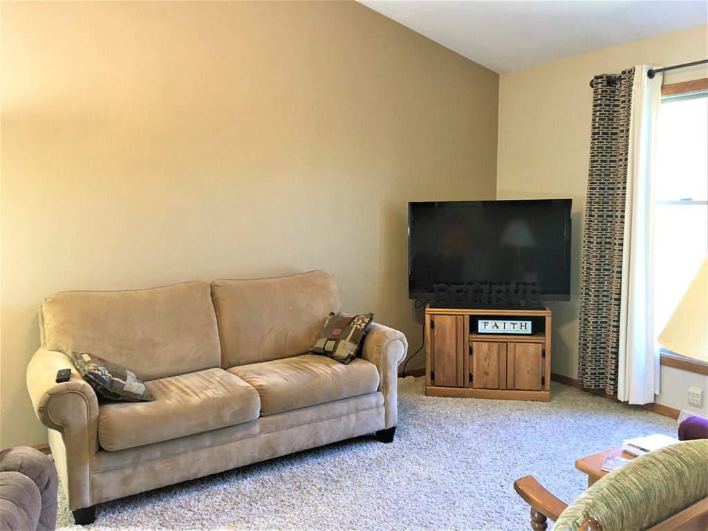 23273 Fry Road Venango, PA 16440 - Photo 40 of 74 a living room with furniture and a flat screen tv