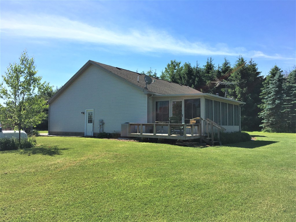 23273 Fry Road Venango, PA 16440 - Photo 4 of 74 a backyard of a house with table and chairs